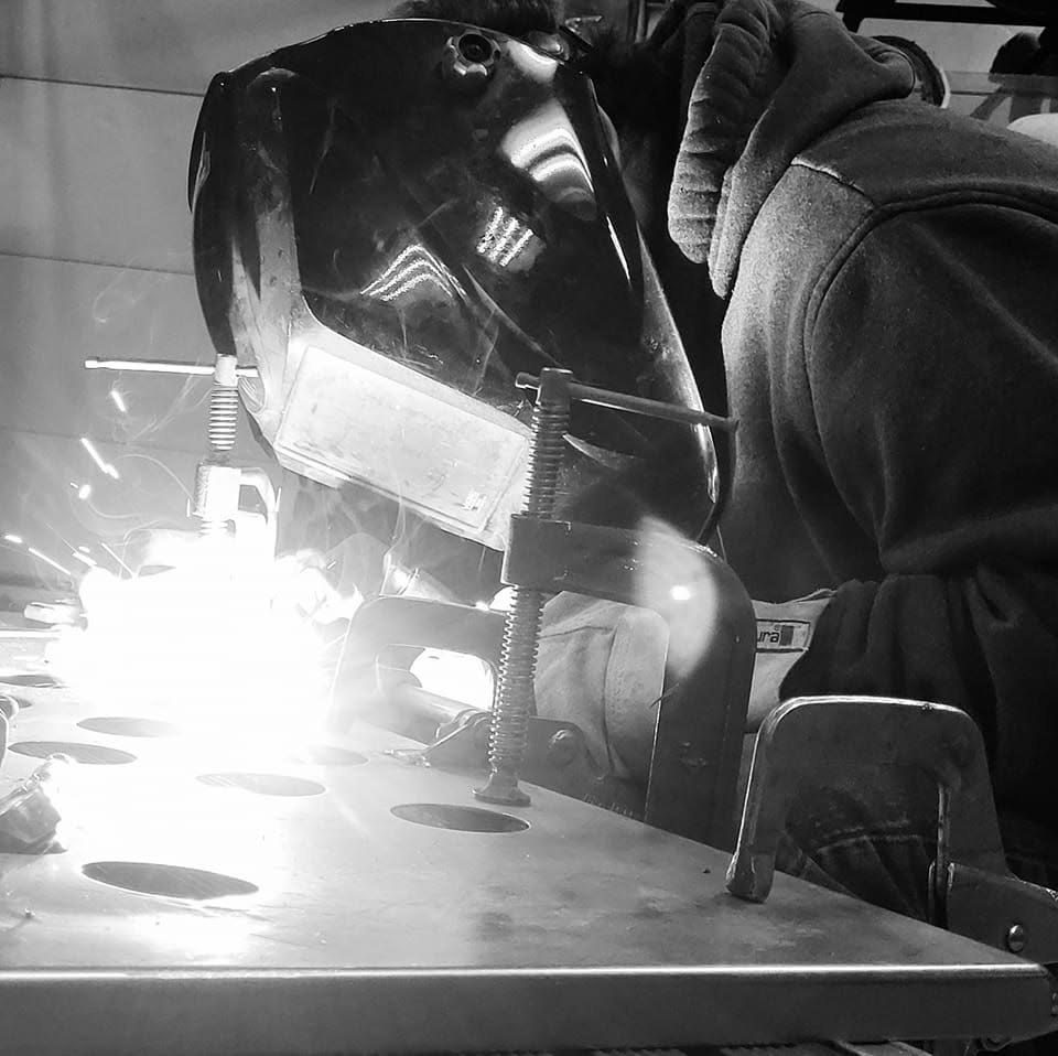 Person welding metal