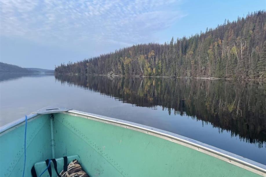 Calm lake with forested shoreline