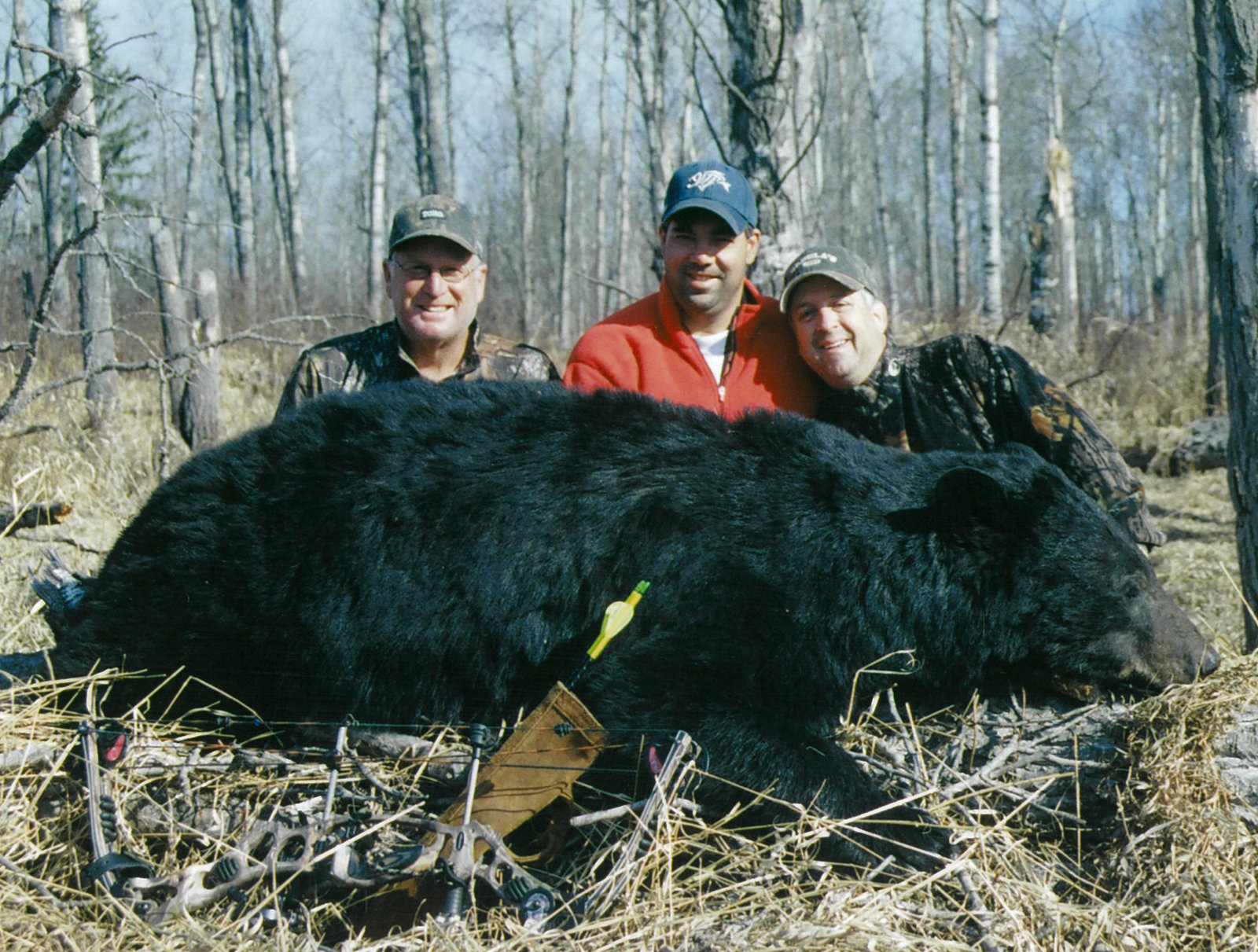 Hunters with a black bear