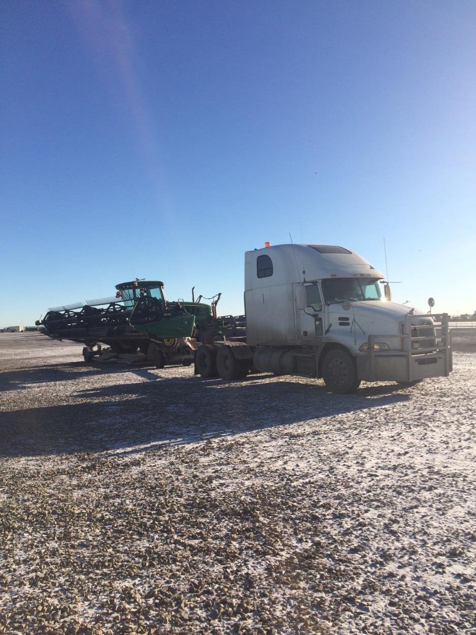 SuzyQ Transport semi hauling a combine header in winter