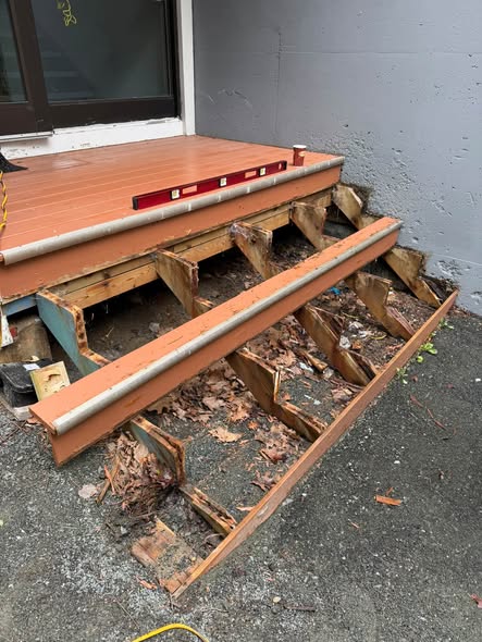 Exposed stair stringers during a rebuild