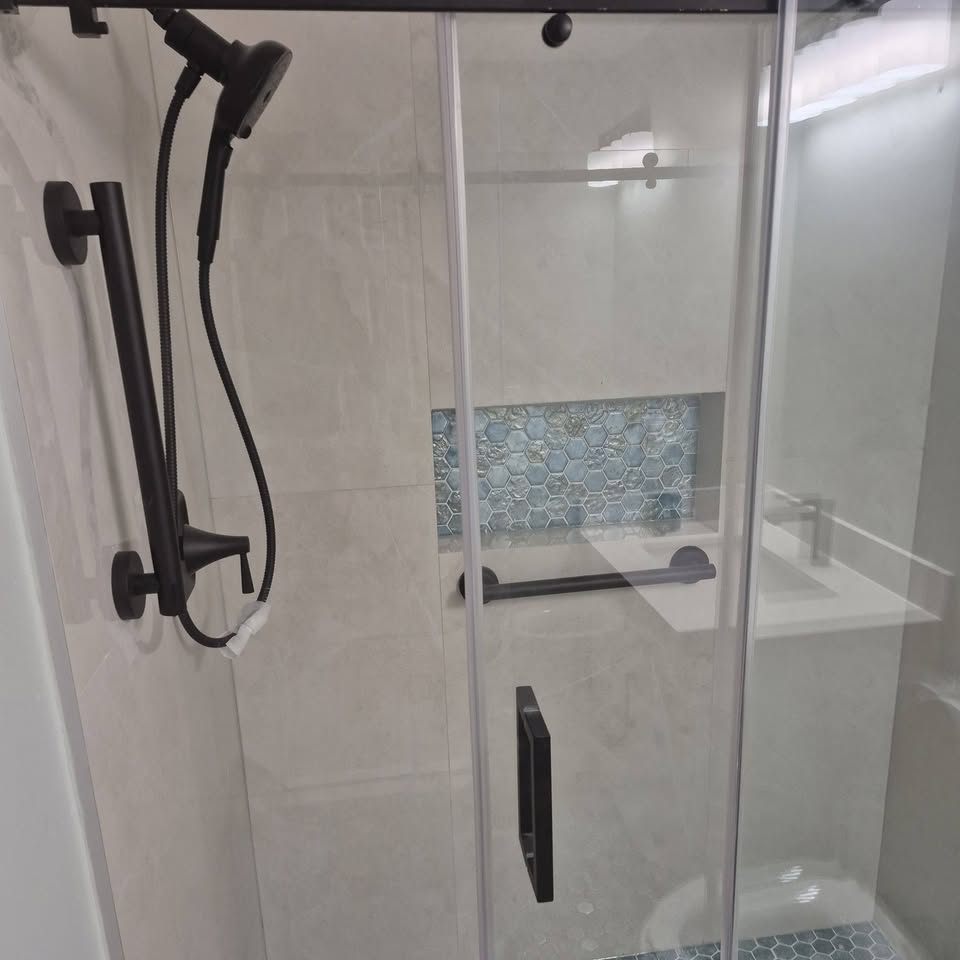 Shower with glass door and matte black fixtures