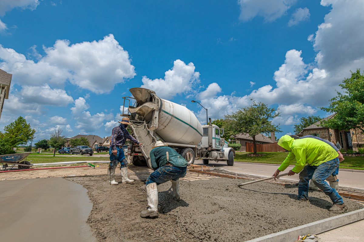 Concrete workers building a driveway