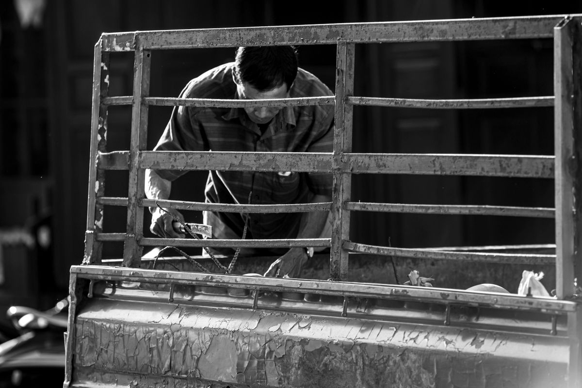 Mechanic working on a truck and heavy equipment