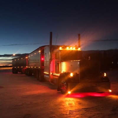 Grain rig at dusk with marker lights