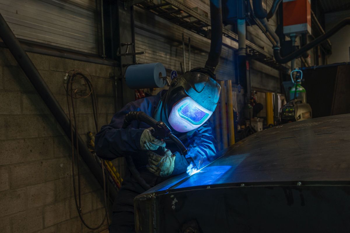 Person welding metal