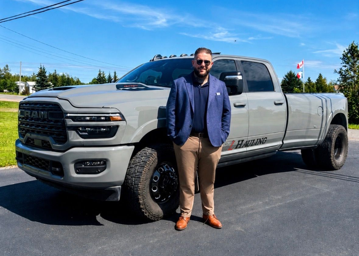 TL Hauling owner Tyson Leblanc beside the truck