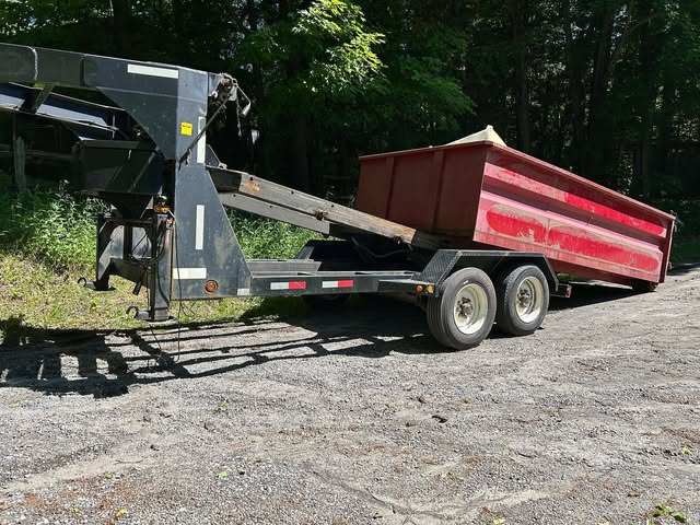 Dump trailer loaded with a junk removal job