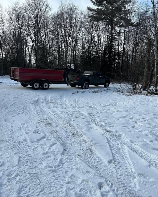 Gooseneck roll-off trailer with a disposal bin