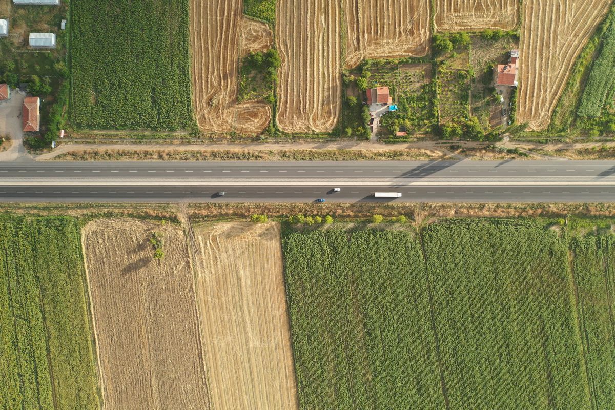 Aerial view of farmland and a highway