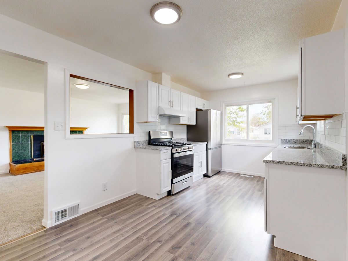 Renovated kitchen with white cabinets